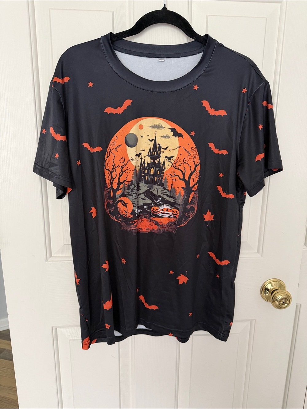 Black Halloween Graphic Tee with Orange Haunted Castle Print